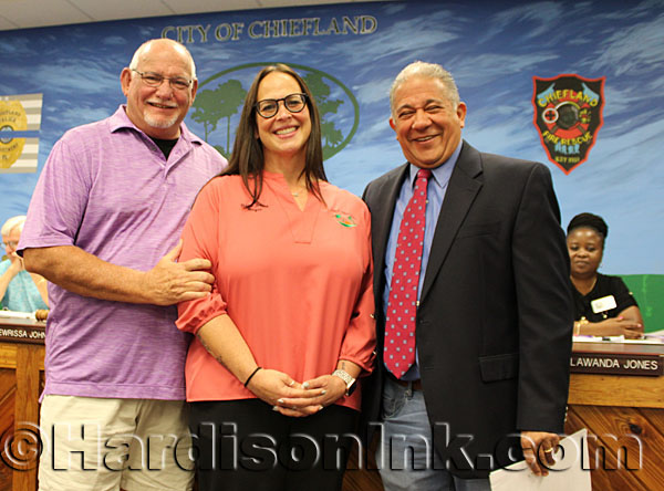 Neal and Lewrissa Johns stand with Judge Luis Bustamante